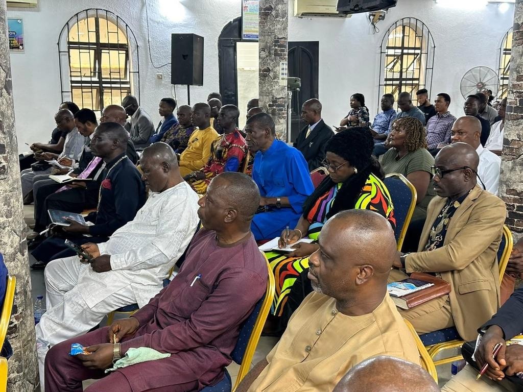 Pastor leading a congregation in worship